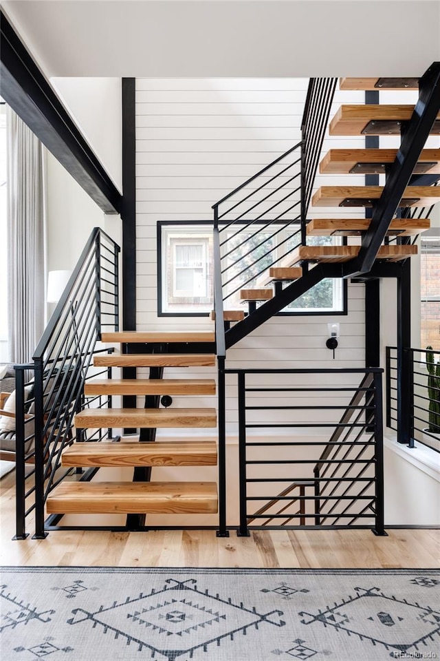 619 S High St, Denver, CO 80209 - stairway featuring wood finished floors