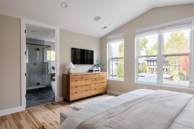 619 S High St, Denver, CO 80209 - bedroom featuring light wood-style floors, lofted ceiling, baseboards, and connected bathroom