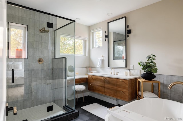 619 S High St, Denver, CO 80209 - full bathroom featuring a freestanding bath, a shower stall, vanity, and tile patterned floors