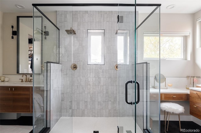 619 S High St, Denver, CO 80209 - full bathroom featuring vanity, a stall shower, and backsplash