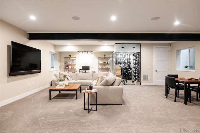 619 S High St, Denver, CO 80209 - living room with light carpet, baseboards, recessed lighting, and beam ceiling