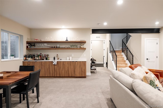 619 S High St, Denver, CO 80209 - indoor wet bar featuring stairs, recessed lighting, and light colored carpet