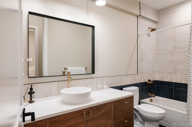 619 S High St, Denver, CO 80209 - bathroom featuring toilet, vanity, bathtub / shower combination, and decorative backsplash