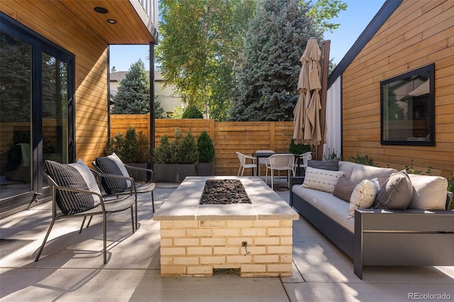 619 S High St, Denver, CO 80209 - view of patio / terrace featuring an outdoor living space with a fire pit and outdoor dining area