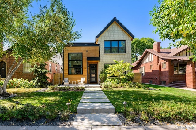 619 S High St, Denver, CO 80209 - contemporary home featuring a front lawn and brick siding