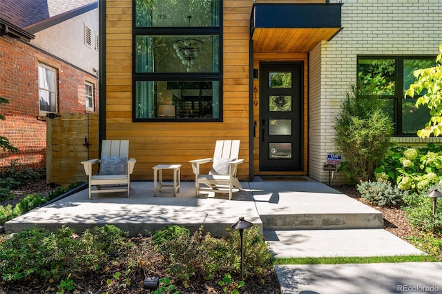 619 S High St, Denver, CO 80209 - property entrance featuring brick siding