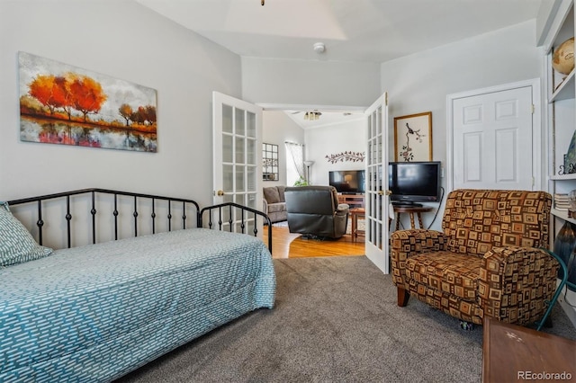 2670 E 136th Pl, Thornton, CO 80602 - carpeted bedroom featuring french doors and vaulted ceiling