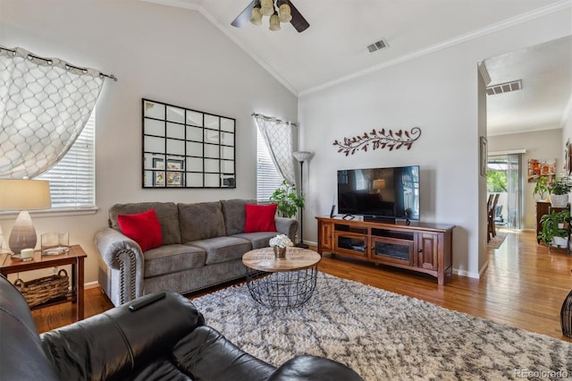 2670 E 136th Pl, Thornton, CO 80602 - living area with ceiling fan, wood finished floors, crown molding, baseboards, and vaulted ceiling