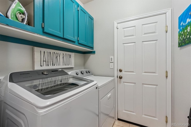 2670 E 136th Pl, Thornton, CO 80602 - laundry area with washing machine and clothes dryer, cabinet space, and light tile patterned floors