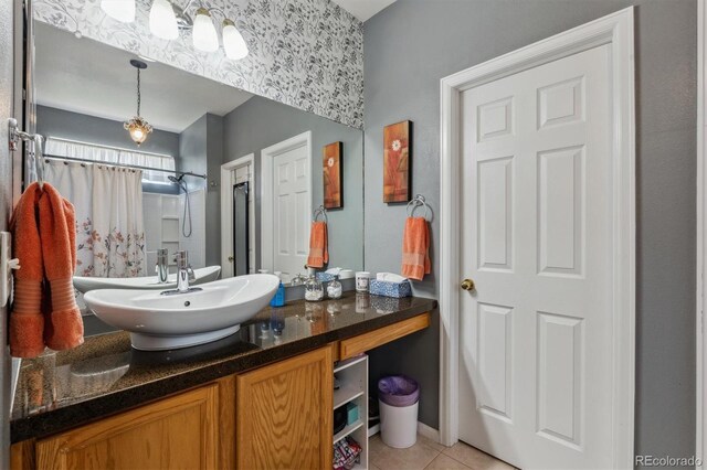 2670 E 136th Pl, Thornton, CO 80602 - bathroom with tile patterned flooring, vanity, and curtained shower