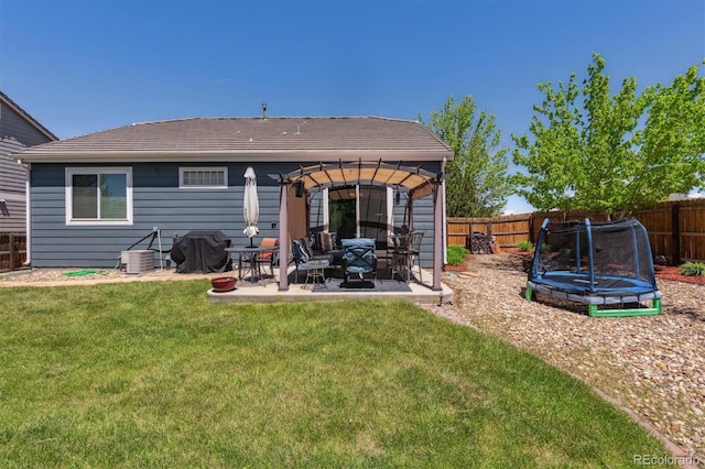 2670 E 136th Pl, Thornton, CO 80602 - rear view of house with a trampoline, a pergola, a patio area, and central air condition unit