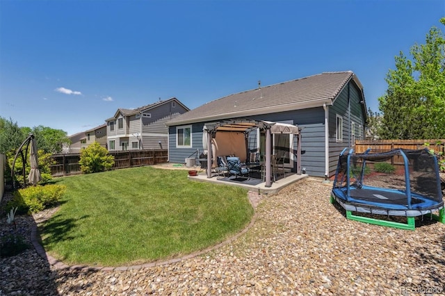 2670 E 136th Pl, Thornton, CO 80602 - rear view of house featuring a pergola, a trampoline, and a patio area