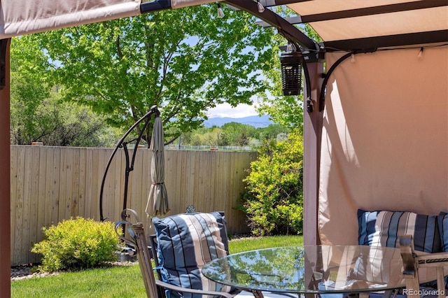 2670 E 136th Pl, Thornton, CO 80602 - view of patio with outdoor dining space, fence, and a pergola