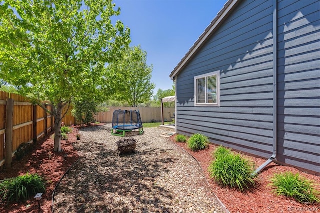 2670 E 136th Pl, Thornton, CO 80602 - fenced backyard with a trampoline