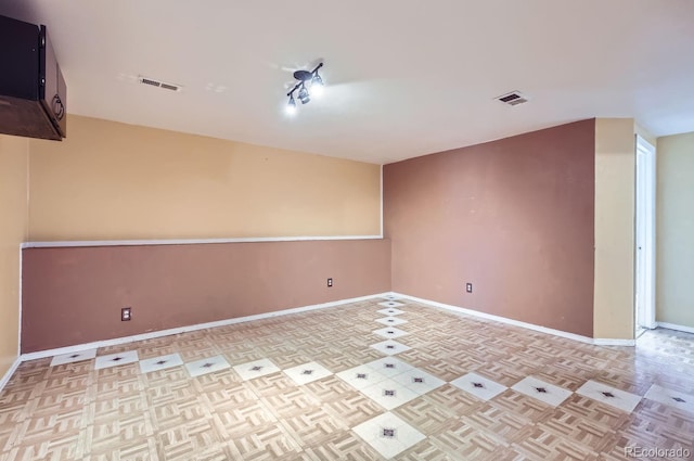 empty room with light parquet flooring