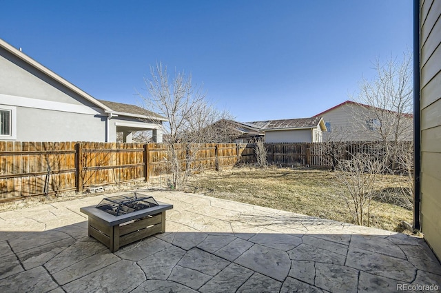 view of patio / terrace with an outdoor fire pit