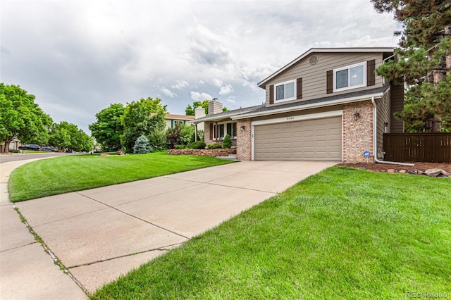 8588 S Woody Way, Highlands Ranch, CO 80126 - view of front of home featuring brick siding, an attached garage, driveway, a front yard, and a chimney