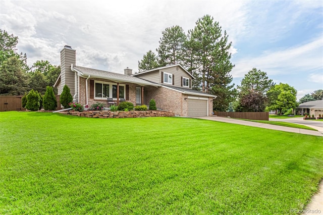 8588 S Woody Way, Highlands Ranch, CO 80126 - view of front facade featuring a chimney, driveway, brick siding, and an attached garage