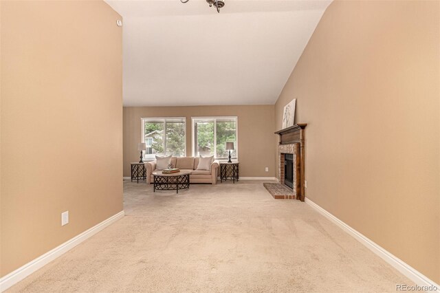 8588 S Woody Way, Highlands Ranch, CO 80126 - living room with carpet flooring, a fireplace, and lofted ceiling
