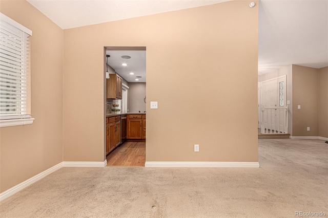 8588 S Woody Way, Highlands Ranch, CO 80126 - empty room with light carpet and vaulted ceiling