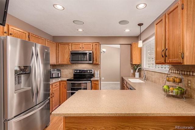 8588 S Woody Way, Highlands Ranch, CO 80126 - kitchen with appliances with stainless steel finishes, decorative backsplash, light stone counters, and recessed lighting