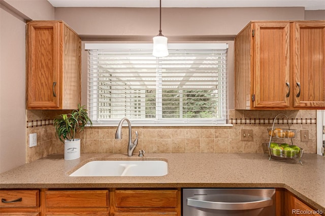 8588 S Woody Way, Highlands Ranch, CO 80126 - kitchen featuring stainless steel dishwasher, backsplash, plenty of natural light, and light stone counters
