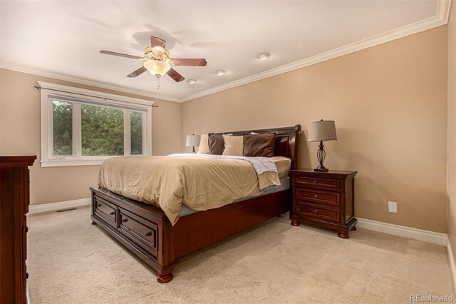 8588 S Woody Way, Highlands Ranch, CO 80126 - bedroom with light carpet, ornamental molding, and ceiling fan
