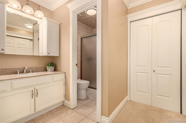 8588 S Woody Way, Highlands Ranch, CO 80126 - bathroom with vanity, ornamental molding, a closet, an enclosed shower, and tile patterned flooring