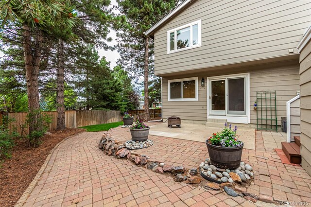 8588 S Woody Way, Highlands Ranch, CO 80126 - fenced backyard with a patio area