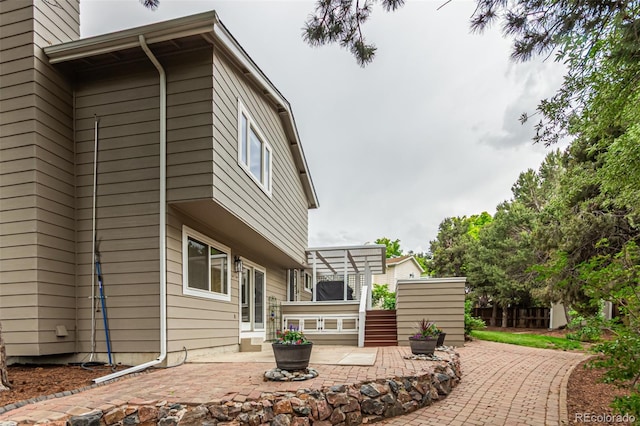 8588 S Woody Way, Highlands Ranch, CO 80126 - view of side of property featuring a patio area
