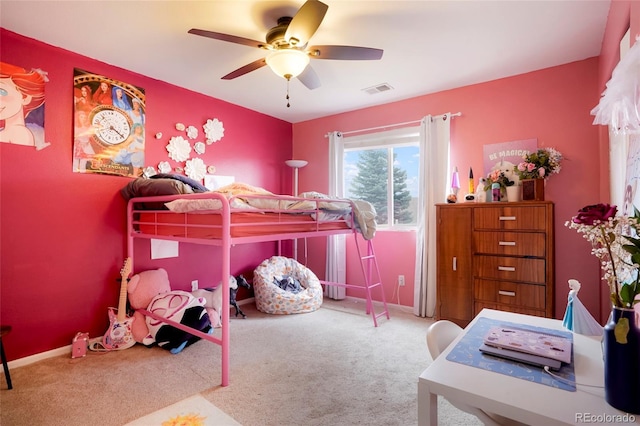 carpeted bedroom with baseboards, visible vents, and a ceiling fan