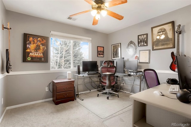 office with carpet floors, visible vents, baseboards, and a ceiling fan