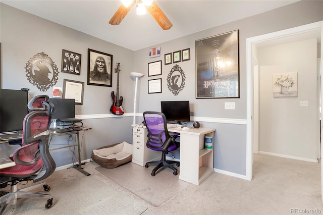 office area with ceiling fan and baseboards