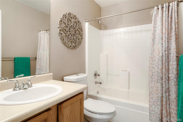 full bathroom with shower / tub combo, vanity, and toilet