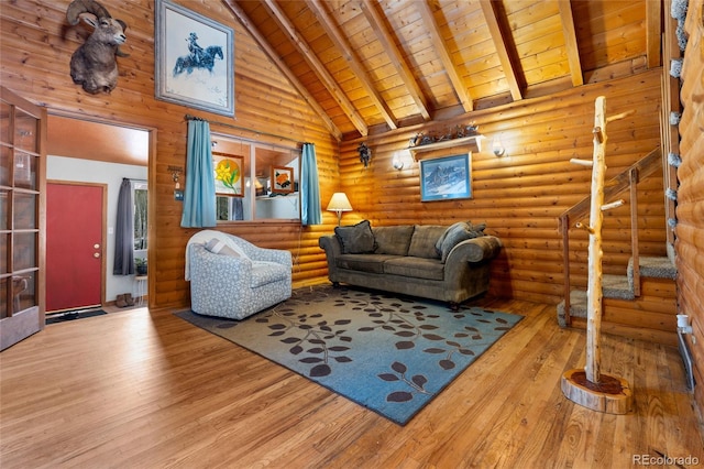 9061 N Rex Ln, Conifer, CO 80433 - living area with wood-type flooring, stairway, wood ceiling with exposed beams, and high vaulted ceiling