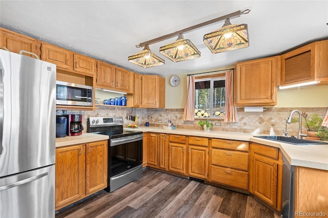 9061 N Rex Ln, Conifer, CO 80433 - kitchen featuring stainless steel appliances, a sink, light countertops, and tasteful backsplash