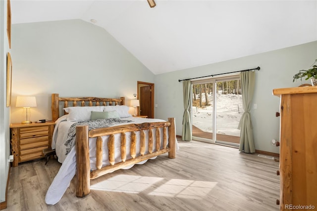 9061 N Rex Ln, Conifer, CO 80433 - bedroom featuring access to outside, lofted ceiling, light wood-style flooring, and baseboards