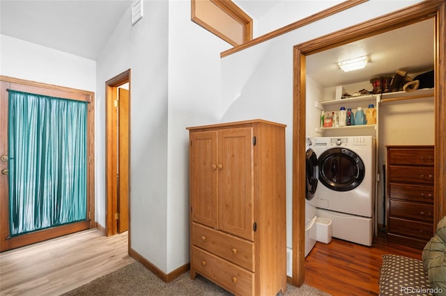 9061 N Rex Ln, Conifer, CO 80433 - washroom featuring washing machine and clothes dryer, light wood-style flooring, and baseboards