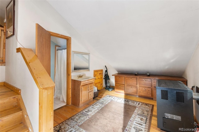 9061 N Rex Ln, Conifer, CO 80433 - full bathroom with hardwood / wood-style floors, vanity, vaulted ceiling, and curtained shower