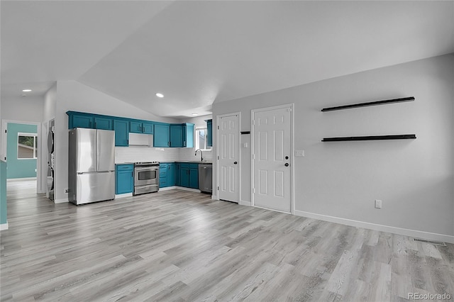3470 W Walsh Pl, Denver, CO 80219 - kitchen featuring appliances with stainless steel finishes, blue cabinetry, lofted ceiling, light wood-style flooring, and tasteful backsplash