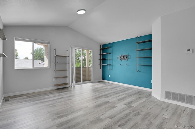 3470 W Walsh Pl, Denver, CO 80219 - spare room featuring wood finished floors and vaulted ceiling