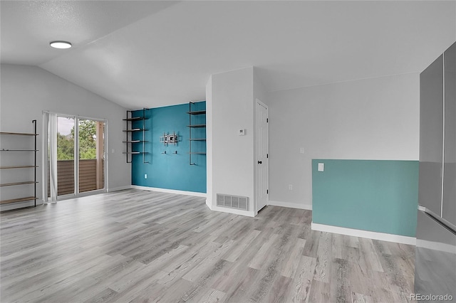 3470 W Walsh Pl, Denver, CO 80219 - unfurnished living room with light wood-style flooring and lofted ceiling
