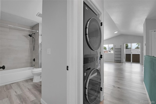 3470 W Walsh Pl, Denver, CO 80219 - laundry room with stacked washing machine and dryer and wood finished floors