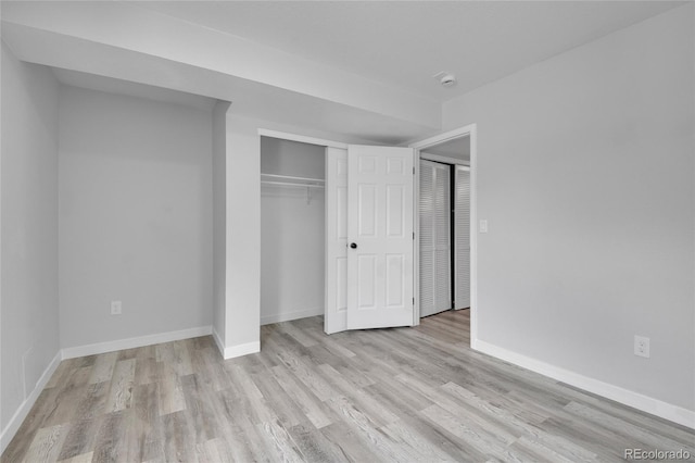 3470 W Walsh Pl, Denver, CO 80219 - unfurnished bedroom with wood finished floors and a closet