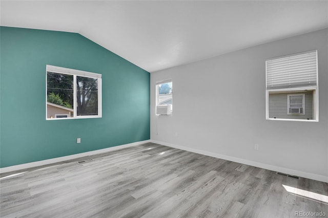3470 W Walsh Pl, Denver, CO 80219 - empty room with wood finished floors and lofted ceiling