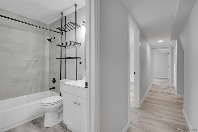 3470 W Walsh Pl, Denver, CO 80219 - full bath featuring bathing tub / shower combination, wood finished floors, and vanity