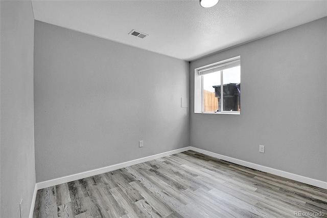 3470 W Walsh Pl, Denver, CO 80219 - spare room featuring wood finished floors and baseboards
