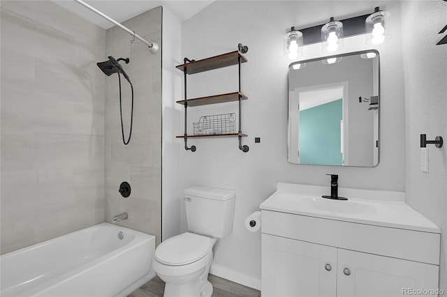 3470 W Walsh Pl, Denver, CO 80219 - bathroom with vanity, tub / shower combination, and wood finished floors