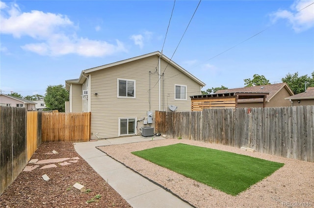 3470 W Walsh Pl, Denver, CO 80219 - back of property with a fenced backyard and a patio area