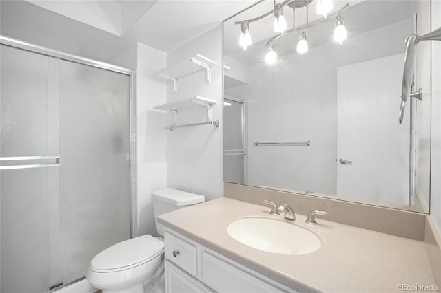 bathroom featuring an enclosed shower, vanity, a baseboard radiator, and toilet